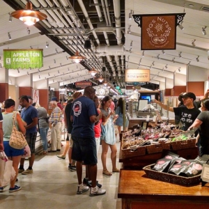 aisle in an open food market with people